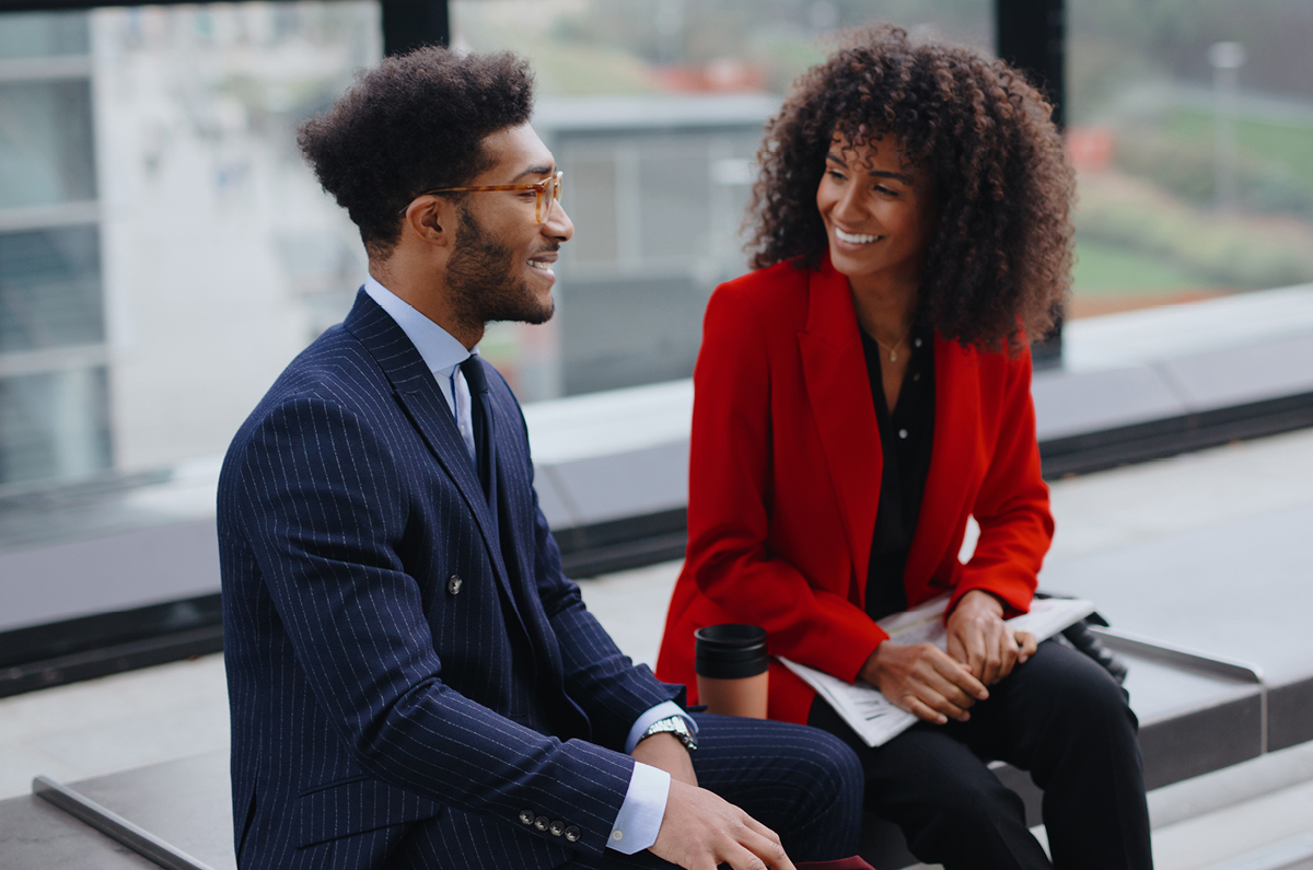 Two people sitting and talking.